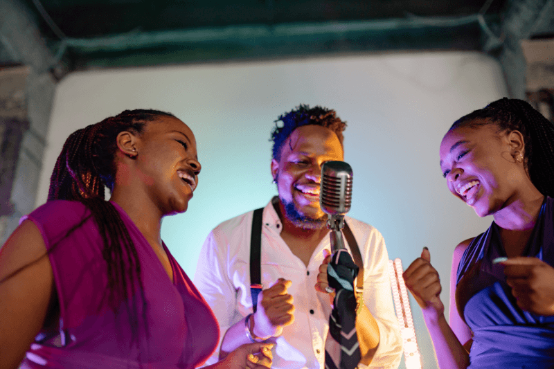 Performers singing together at an event